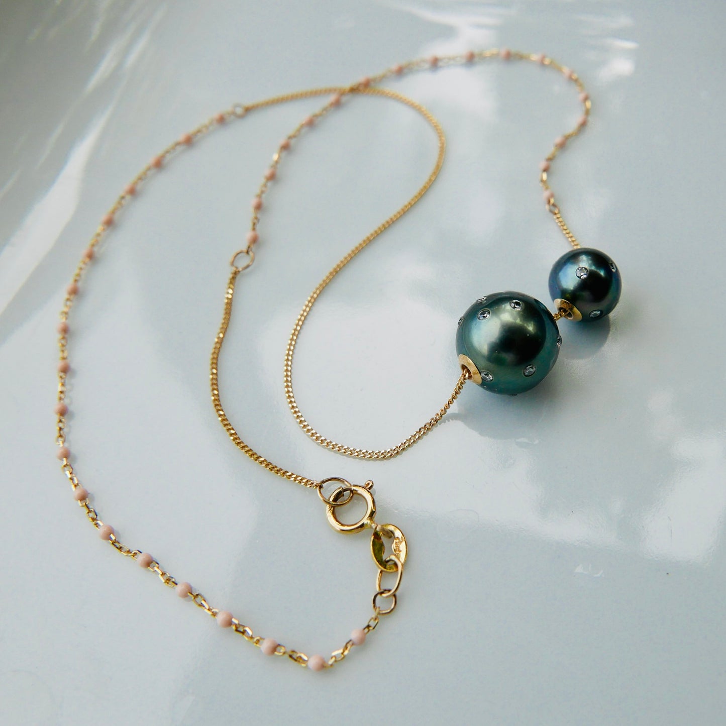 Tahitian pearl and a baby , with diamonds 18kt gold