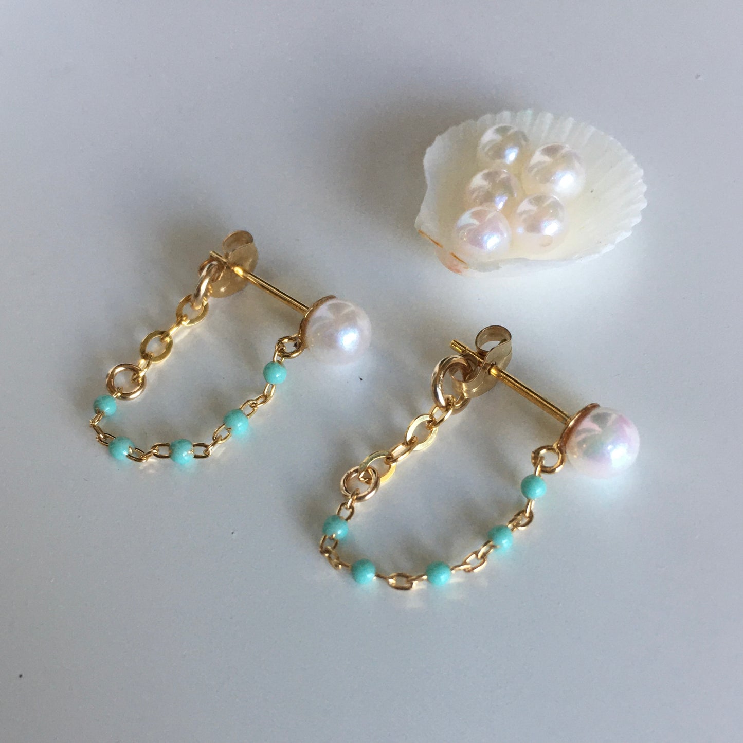 Akoya pearls earrings , chain hoops in waikiki blue