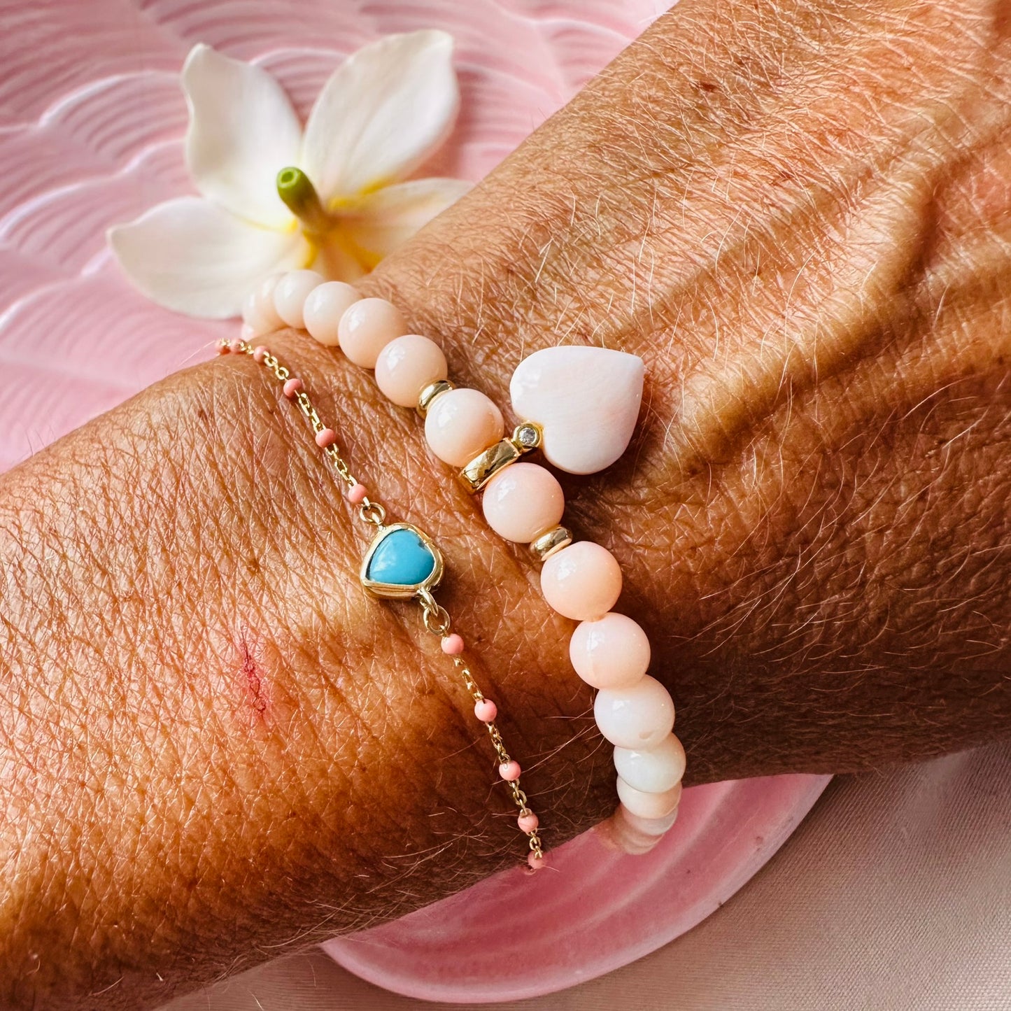 Graduated coral LOVE bracelet