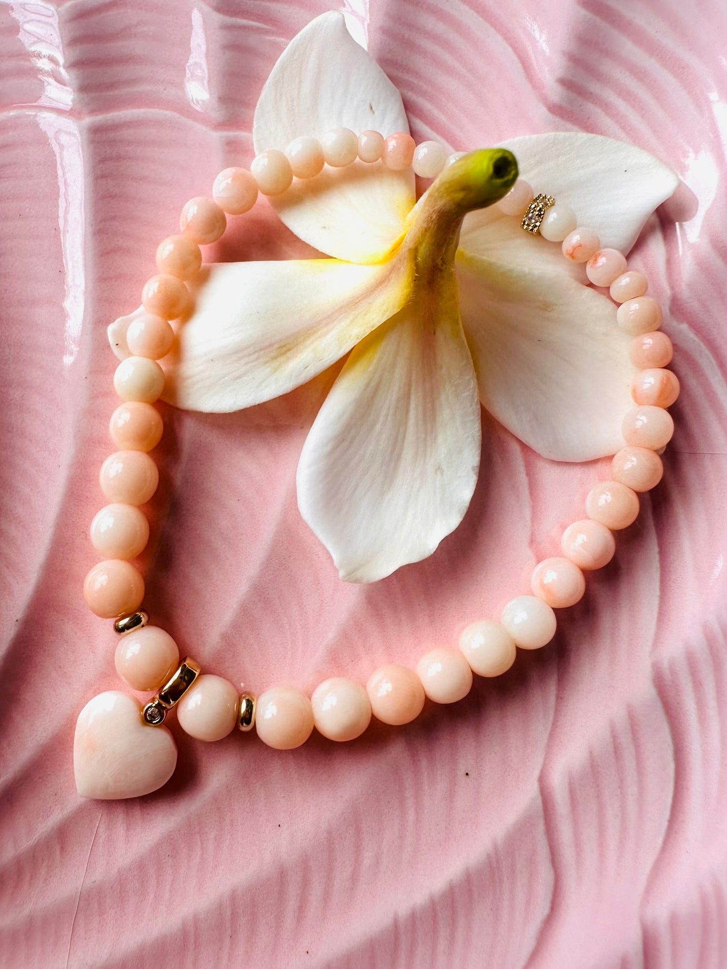 Graduated coral LOVE bracelet