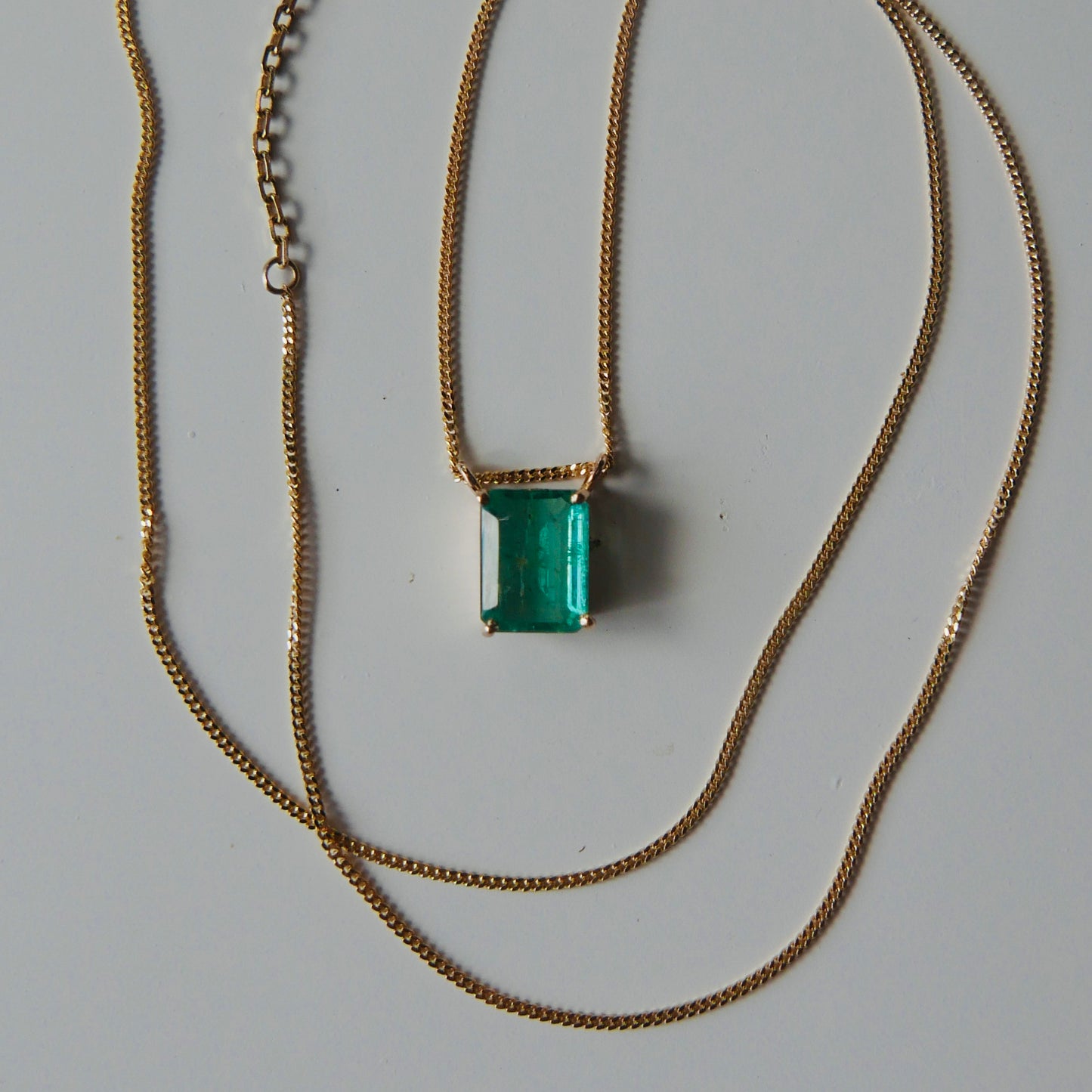 Emerald necklace with curb chain