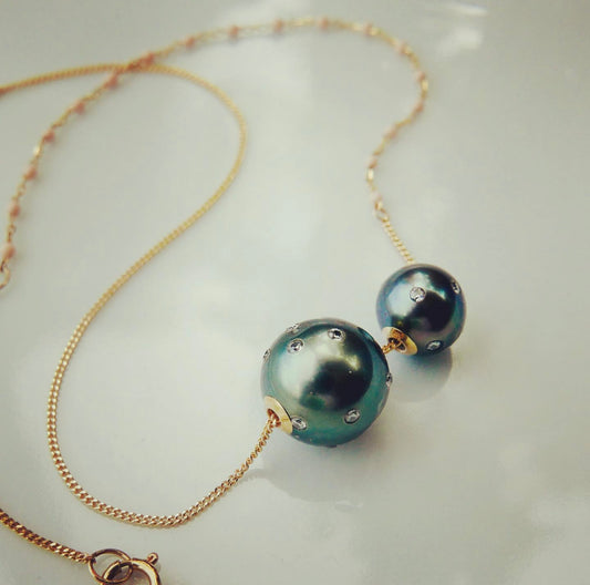 Tahitian pearl and a baby , with diamonds 18kt gold