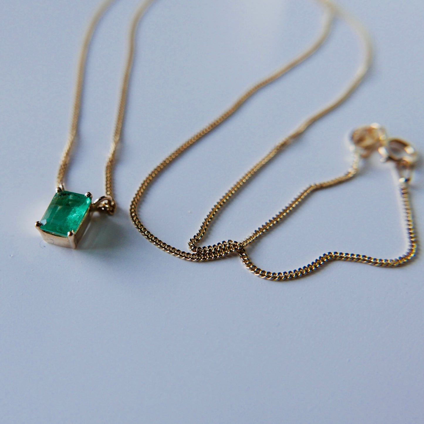 Emerald necklace with curb chain