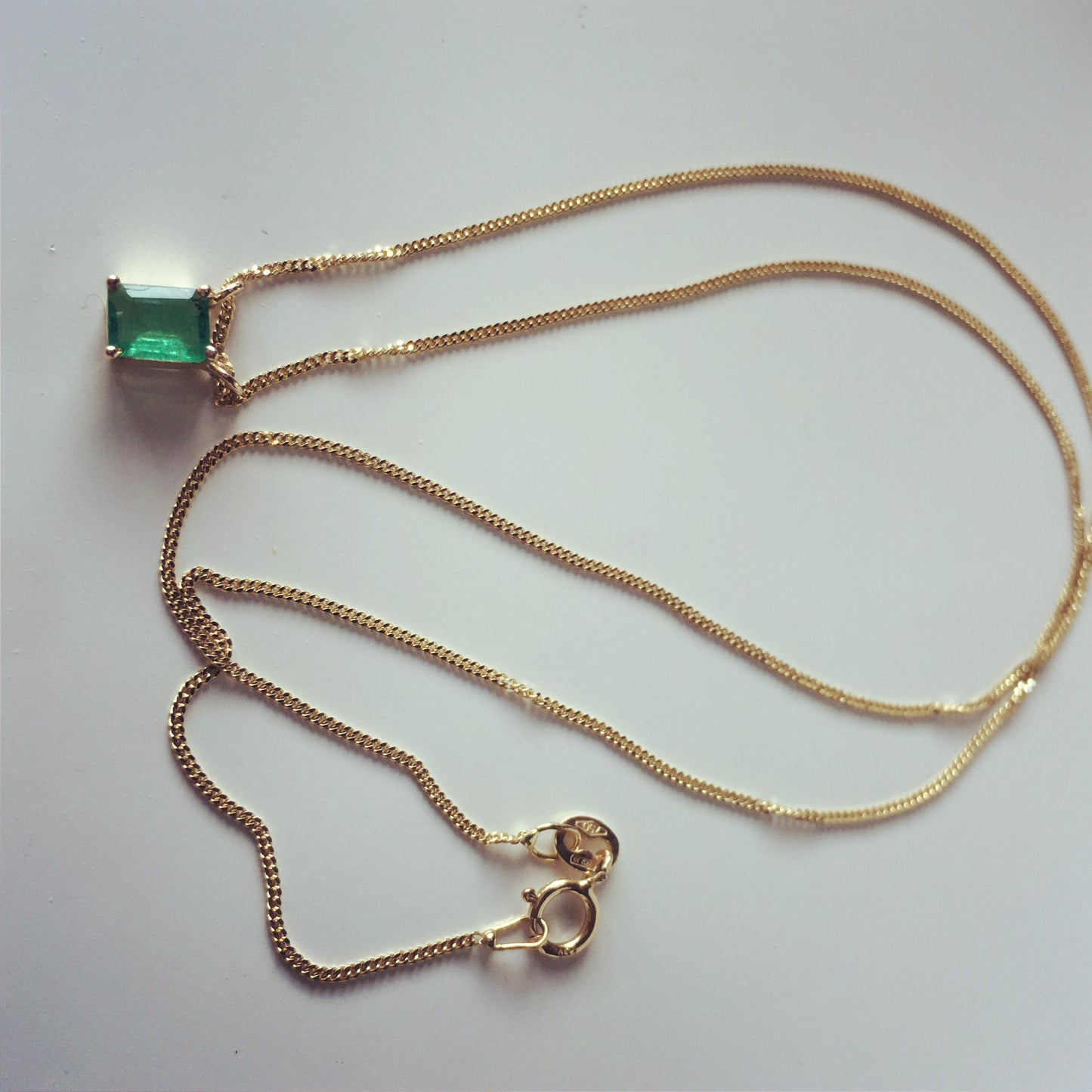 Emerald necklace with curb chain